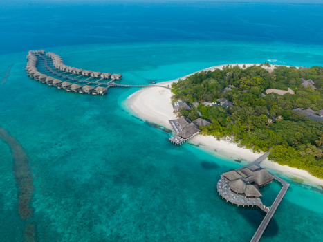 Aerial view of the island s verdant canopy contrasting with the turquoise waters and pristine white sands Hoarafushi Thiladhunmathee Uthuruburi Maldives. Aerial view of the island s verdant canopy contrasting with the turquoise waters and pristine white sands Hoarafushi Thiladhunmathee Uthuruburi Maldives.