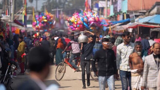 View of a crowded street market with people and balloons Bangladesh. View of a crowded street market with people and balloons Bangladesh.