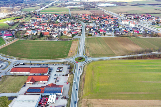 Aerial view of the village of Buttenheim with residential houses and a central roundabout surrounded by fields Buttenheim Bavaria Germany. Aerial view of the village of Buttenheim with residential houses and a central roundabout surrounded by fields Buttenheim Bavaria Germany.