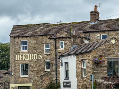 Hawes United Kingdom 05 July 2025 View of the historic Herriot s stone building with traditional masonry sash windows and flower boxes in the Yorkshire Dales. Hawes United Kingdom 05 July 2025 View of the historic Herriot s stone building with traditional masonry sash windows and flower boxes in the Yorkshire Dales.