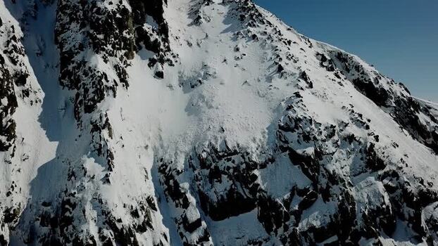 Aerial view of snowy mountain slopes in the Pyrenees Spain.