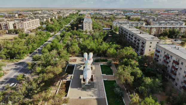 Aerial view of the Baikonur Cosmodrome rocket monument situated in a park surrounded by residential apartment blocks in Karmakshy District Kyzylorda Region Kazakhstan.