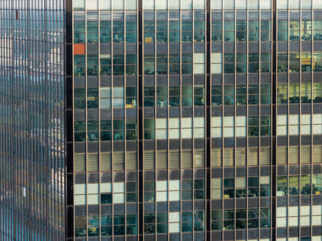 Aerial view of the Berlin Treptowers office building facade featuring a grid of glass windows in Berlin Berlin Germany. Aerial view of the Berlin Treptowers office building facade featuring a grid of glass windows in Berlin Berlin Germany.
