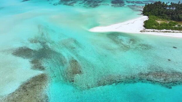 Aerial view of turquoise lagoon and white sand beach Maldives. Aerial view of turquoise lagoon and white sand beach Maldives.