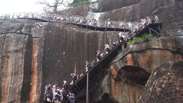 View of tourists climbing the stairs of Sigiriya Rock Sri Lanka.