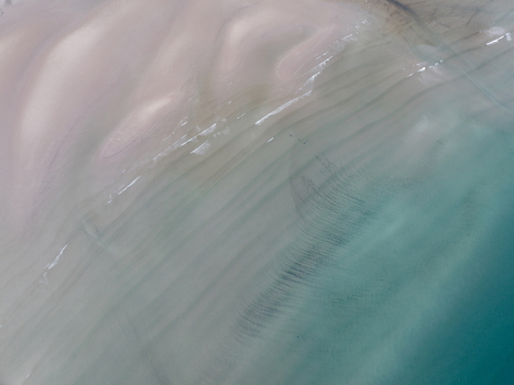 Aerial view of the turquoise water and sand ripples along the shoreline of Gruinard Bay Gruinard Scotland United Kingdom. Aerial view of the turquoise water and sand ripples along the shoreline of Gruinard Bay Gruinard Scotland United Kingdom.