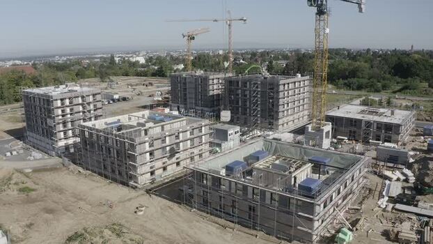 Aerial view of Bessungen construction site with cranes Germany.
