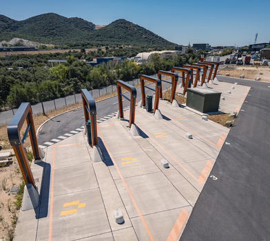 Malataverne Auvergne Rhone Alpes France 06 July 2026 Aerial view of the Milence electric truck charging hub featuring modern wooden structures and concrete bays in a rural logistics facility.