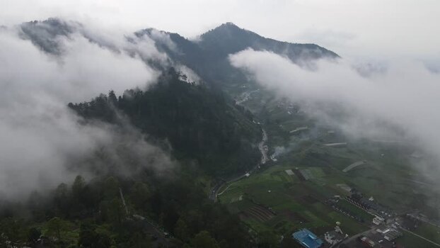 Aerial view of misty mountains and green valleys Indonesia. Aerial view of misty mountains and green valleys Indonesia.