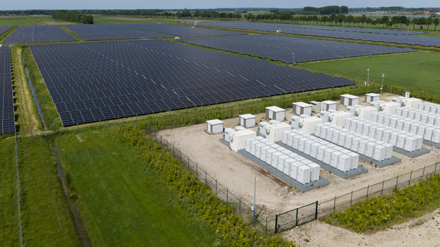 Wanneperveen Netherlands 23 May 2026 Aerial view of a large solar farm with rows of photovoltaic panels and a battery energy storage system facility surrounded by green fields. Wanneperveen Netherlands 23 May 2026 Aerial view of a large solar farm with rows of photovoltaic panels and a battery energy storage system facility surrounded by green fields.