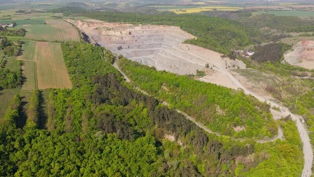 Aerial view of an open pit quarry and green forests Czechia. Aerial view of an open pit quarry and green forests Czechia.