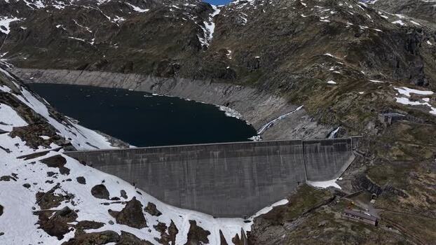 Aerial view of Lucendro Dam in the snowy mountains Switzerland. Aerial view of Lucendro Dam in the snowy mountains Switzerland.