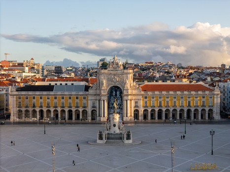 Aerial view of Praca do Comercio featuring the Rua Augusta Arch and the statue of King Jose I under a cloudy sky in Lisbon Lisbon Portugal. Aerial view of Praca do Comercio featuring the Rua Augusta Arch and the statue of King Jose I under a cloudy sky in Lisbon Lisbon Portugal.