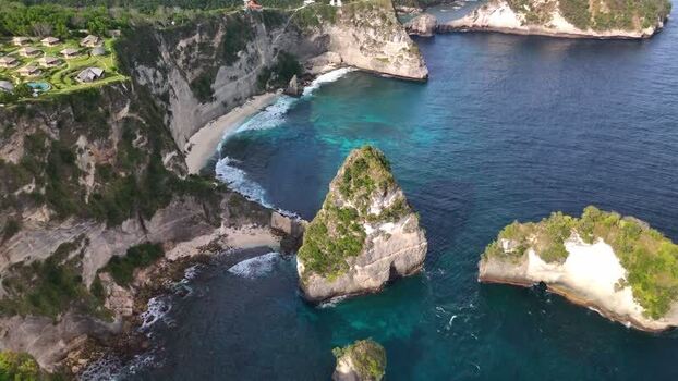 Aerial view of Diamond Beach cliffs and turquoise ocean in Indonesia. Aerial view of Diamond Beach cliffs and turquoise ocean in Indonesia.