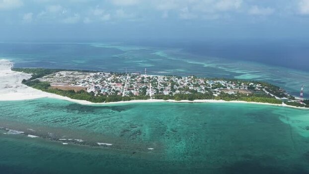Aerial view of Makunudhoo island and coral reefs Maldives. Aerial view of Makunudhoo island and coral reefs Maldives.