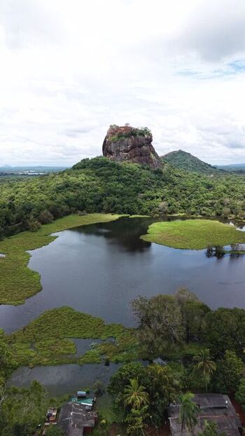 Aerial view of Sigiriya Rock and lush tropical forests Sri Lanka.