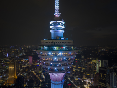 Kuala Lumpur Malaysia 11 March 2026 Aerial view of the illuminated KL Tower at night with the city skyline and glowing urban lights in the background.