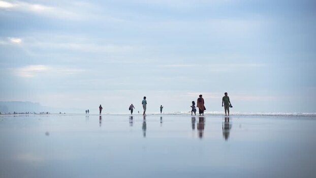 View of people walking on Cox s Bazar beach Bangladesh. View of people walking on Cox s Bazar beach Bangladesh.
