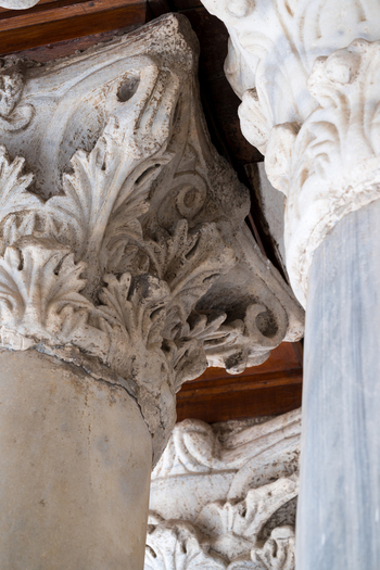 View of the intricate marble column capitals with detailed acanthus leaf carvings at the Al Azhar Mosque in Cairo Egypt. View of the intricate marble column capitals with detailed acanthus leaf carvings at the Al Azhar Mosque in Cairo Egypt.