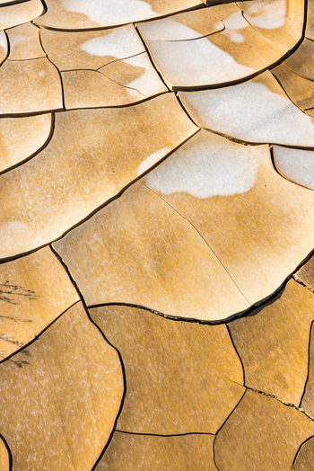 Aerial view of the cracked salt flats of Tuzbair with intricate patterns and textured earth in Mangystau District Mangystau Region Kazakhstan.