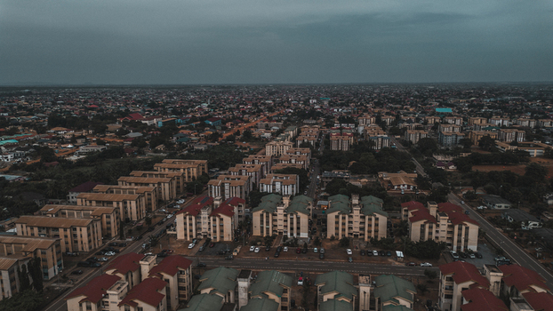 Aerial view of SSNIT Flat residential complex with rows of apartment buildings paved roads and surrounding urban landscape in Adenta Municipality Greater Accra Region Ghana. Aerial view of SSNIT Flat residential complex with rows of apartment buildings paved roads and surrounding urban landscape in Adenta Municipality Greater Accra Region Ghana.