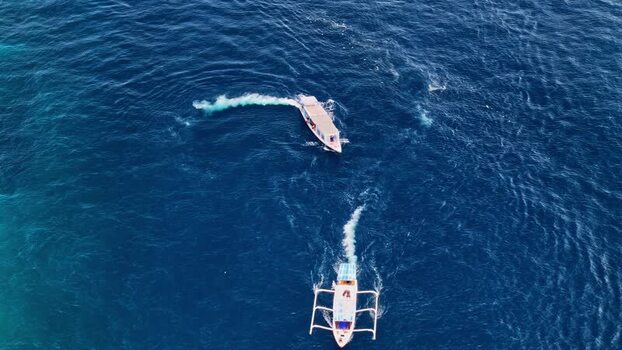Aerial view of traditional outrigger boats in Bali Indonesia.