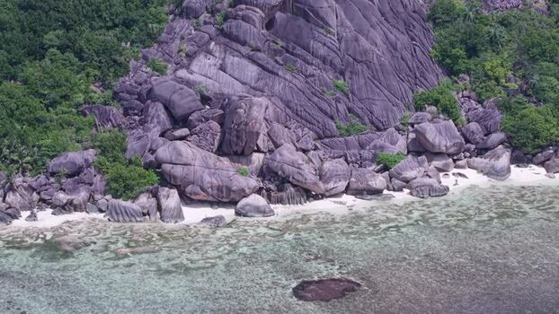 Aerial view of Anse Reunion granite boulders Seychelles.