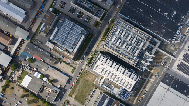 Aerial view of Equinix Data Center on Friesstrasse featuring industrial buildings with rooftop cooling units and solar panels in Frankfurt am Main Hessen Germany.