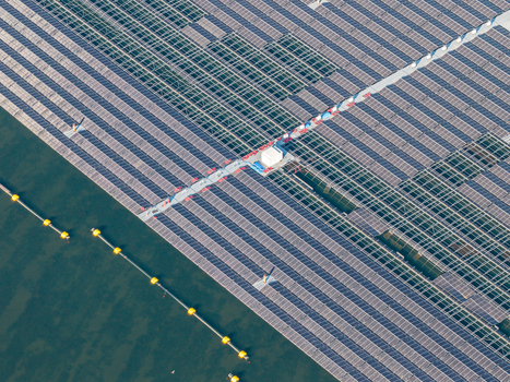 Aerial view of the floating solar park at Cottbuser Ostsee a former open pit mine showing solar panels and repair works on the water in Cottbus Brandenburg Germany. Aerial view of the floating solar park at Cottbuser Ostsee a former open pit mine showing solar panels and repair works on the water in Cottbus Brandenburg Germany.