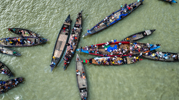 Baghabari Rajshahi Division Bangladesh 20 August 2022 Aerial view of many wooden boats filled with people navigating the river in Baghabari.