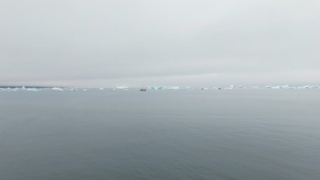 Aerial view of icebergs floating in Disko Bay Greenland. Aerial view of icebergs floating in Disko Bay Greenland.