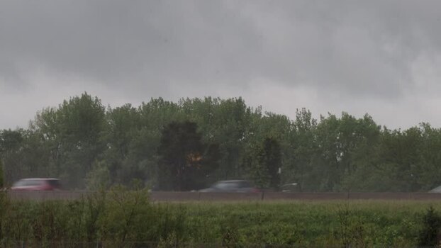 View of highway traffic under a stormy sky United States.