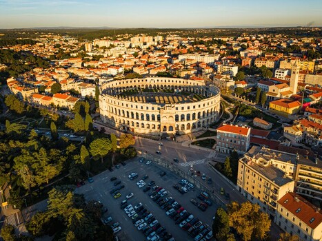 Aerial view of the magnificent Pula Arena a Roman amphitheater stands as a testament to history amidst the vibrant cityscape Pula Istria County Croatia.