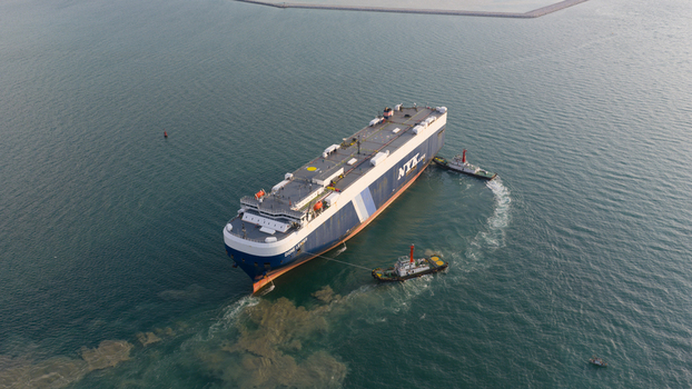 Si Racha District Thailand 08 March 2026 Aerial view of a large NYK Line cargo ship being assisted by two tugboats in the calm waters near Laem Chabang International Terminal. Si Racha District Thailand 08 March 2026 Aerial view of a large NYK Line cargo ship being assisted by two tugboats in the calm waters near Laem Chabang International Terminal.