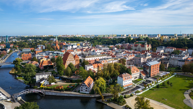 Aerial view of the vibrant red rooftops and winding Brda River meet in a tapestry of urban charm Bydgoszcz Województwo kujawsko pomorskie Poland. Aerial view of the vibrant red rooftops and winding Brda River meet in a tapestry of urban charm Bydgoszcz Województwo kujawsko pomorskie Poland.