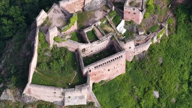 Aerial view of historic castle ruins on a rocky hill France. Aerial view of historic castle ruins on a rocky hill France.