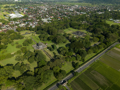 Aerial view of Bubrah Temple surrounded by lush green trees and agricultural fields Kecamatan Prambanan Jawa Tengah Indonesia. Aerial view of Bubrah Temple surrounded by lush green trees and agricultural fields Kecamatan Prambanan Jawa Tengah Indonesia.