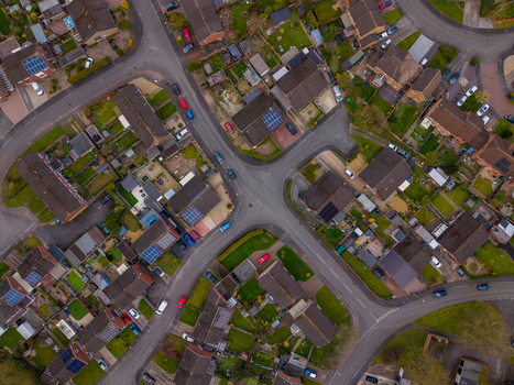Aerial view of the residential area near Doxey Marshes with suburban houses green gardens and solar panels on rooftops in Stafford England United Kingdom. Aerial view of the residential area near Doxey Marshes with suburban houses green gardens and solar panels on rooftops in Stafford England United Kingdom.
