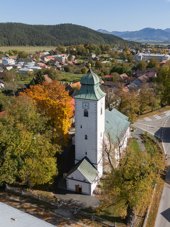 Aerial view of the church tower rising amidst a tapestry of autumn hues the green steeple contrasting with the vibrant foliage Klastor pod Znievom Zilina Region Slovakia. Aerial view of the church tower rising amidst a tapestry of autumn hues the green steeple contrasting with the vibrant foliage Klastor pod Znievom Zilina Region Slovakia.