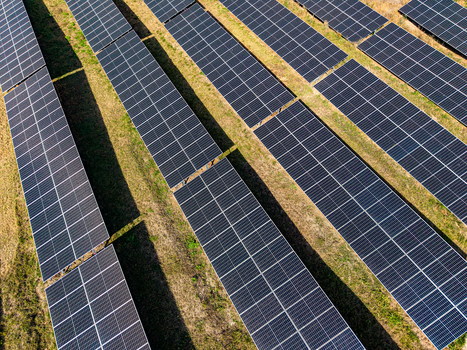 Aerial view of rows of solar panels installed in a field at a solar farm in Targu Secuiesc Covasna County Romania.