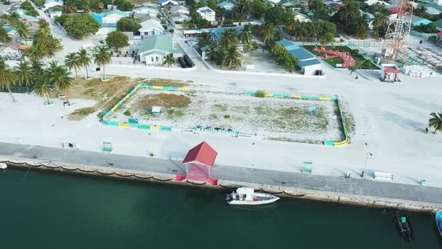 Aerial view of the harbor and coastal town in Makunudhoo Maldives. Aerial view of the harbor and coastal town in Makunudhoo Maldives.