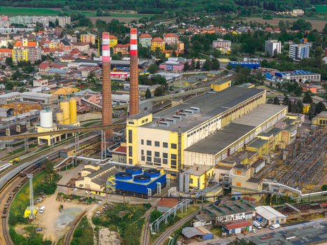 Aerial view of the Tepelna elektrarna Hodonin power station with its distinctive red and white striped chimneys and industrial complex in Hodonin Jihomoravsky kraj Czechia. Aerial view of the Tepelna elektrarna Hodonin power station with its distinctive red and white striped chimneys and industrial complex in Hodonin Jihomoravsky kraj Czechia.