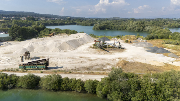 Aerial view of the Extraccion de aridos Lima S.L sand and gravel extraction site with piles of aggregate machinery and conveyor belts in Vilarino das Poldras Ourense Spain. Aerial view of the Extraccion de aridos Lima S.L sand and gravel extraction site with piles of aggregate machinery and conveyor belts in Vilarino das Poldras Ourense Spain.