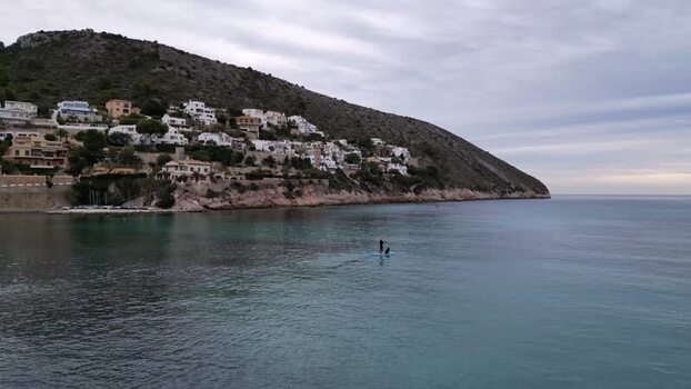 Aerial view of paddleboarder in Moraira Spain.