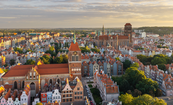 Aerial view of St. Mary s Church and historic city center with dense rooftops narrow streets and the Basilica of the Assumption in Gdansk Pomeranian Voivodeship Poland. Aerial view of St. Mary s Church and historic city center with dense rooftops narrow streets and the Basilica of the Assumption in Gdansk Pomeranian Voivodeship Poland.