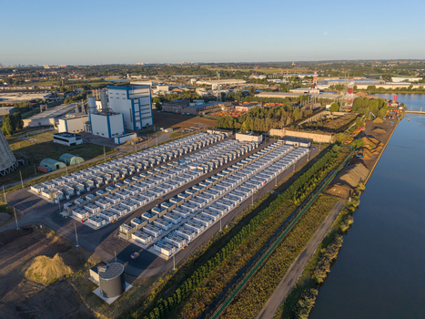 Aerial view of the Cargovil battery energy storage system featuring rows of white containers industrial power plant infrastructure and a canal in Vilvoorde Vlaanderen Belgium. Aerial view of the Cargovil battery energy storage system featuring rows of white containers industrial power plant infrastructure and a canal in Vilvoorde Vlaanderen Belgium.