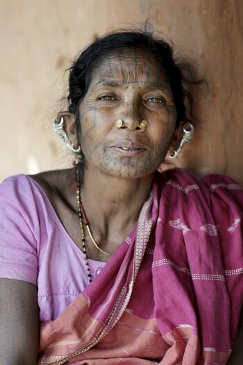Odisha India 26 March 2026 View of an indigenous woman s face adorned with traditional tattoos and stretched earlobes framed by a simple pink saree. Odisha India 26 March 2026 View of an indigenous woman s face adorned with traditional tattoos and stretched earlobes framed by a simple pink saree.