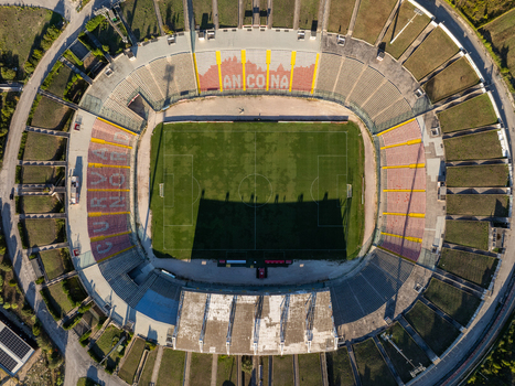 Aerial view of Stadio del Conero with its green pitch surrounding seating tiers and stadium infrastructure in Ancona Marche Italy. Aerial view of Stadio del Conero with its green pitch surrounding seating tiers and stadium infrastructure in Ancona Marche Italy.