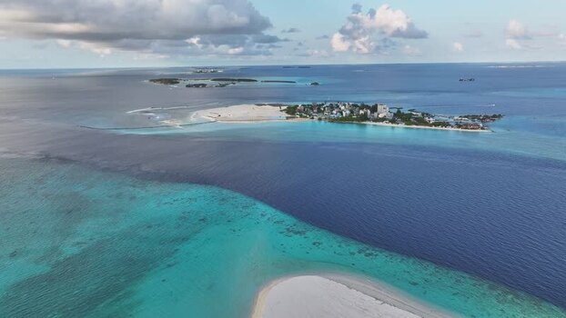 Aerial view of Gulhi island and turquoise coral reefs Maldives. Aerial view of Gulhi island and turquoise coral reefs Maldives.