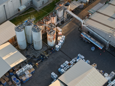Melbourne VIC Australia 22 September 2026 Aerial view of industrial storage tanks pipes and a tanker truck at a factory facility in Kilsyth Melbourne VIC Australia. Melbourne VIC Australia 22 September 2026 Aerial view of industrial storage tanks pipes and a tanker truck at a factory facility in Kilsyth Melbourne VIC Australia.